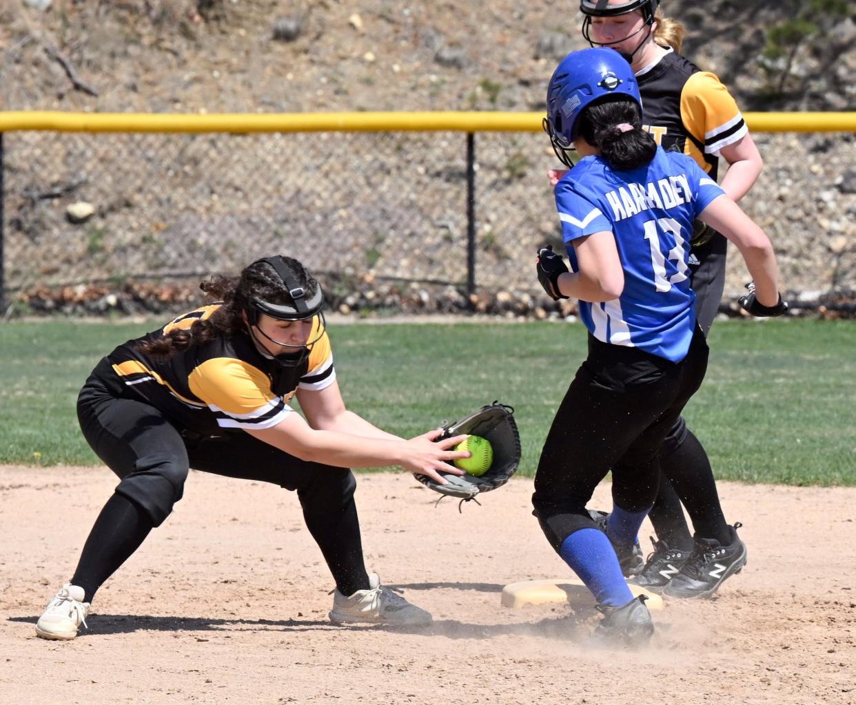 Jaelynn Harraden of Upper Cape Tech arrives at second ahead of the tag by Nauset shortstop Jillian Parrott.