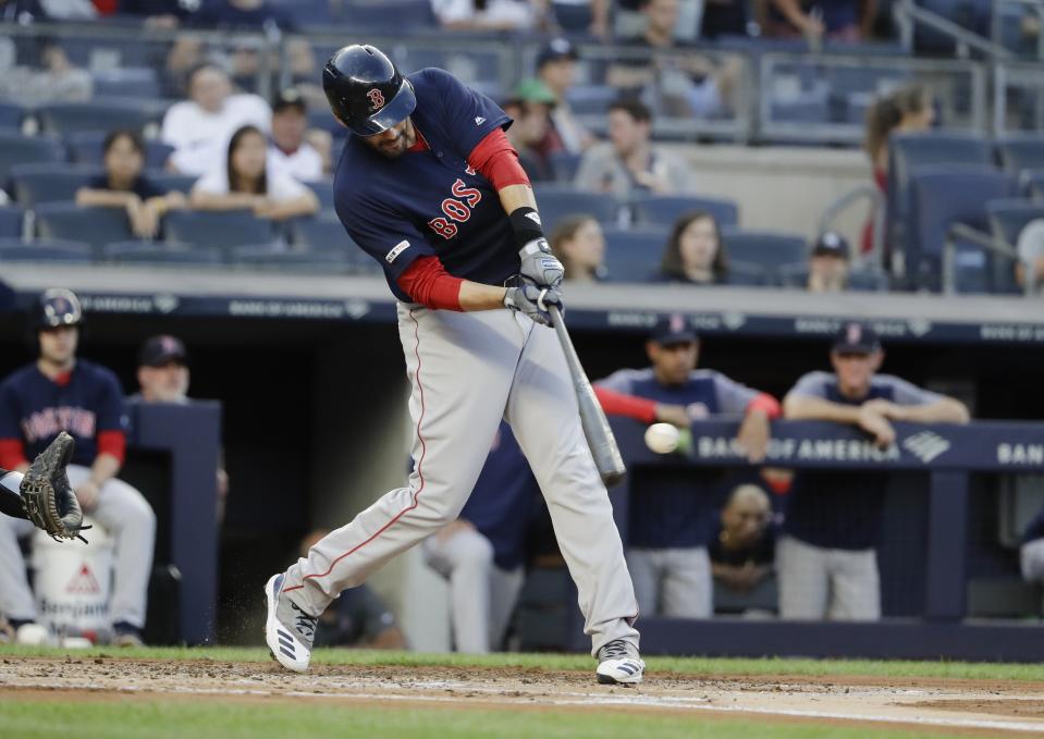 Boston Red Sox's J.D. Martinez hits a two-run home run during the first inning of the team's baseball game against the New York Yankees on Friday, Aug. 2, 2019, in New York. (AP Photo/Frank Franklin II)