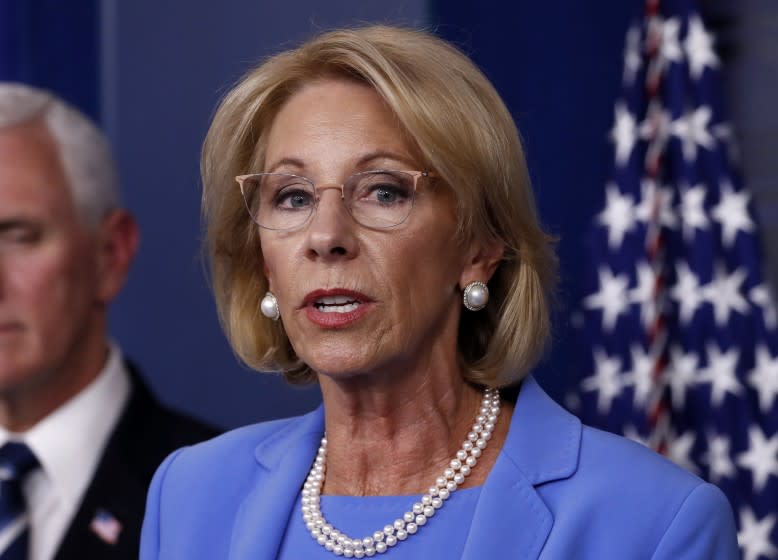 FILE - In this March 27, 2020, file photo, Education Secretary Betsy DeVos speaks about the coronavirus in the James Brady Press Briefing Room in Washington. DeVos is pushing ahead with a policy that will steer tens of millions of dollars in federal coronavirus relief to private primary schools and secondary schools across the nation. (AP Photo/Alex Brandon, File)