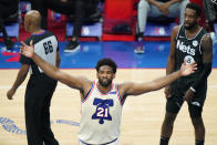 Philadelphia 76ers' Joel Embiid (21) celebrates after scoring during the second half of an NBA basketball game against the Brooklyn Nets, Wednesday, April 14, 2021, in Philadelphia. (AP Photo/Matt Slocum)