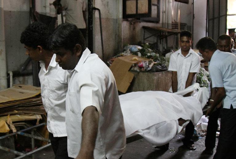 The remains of President Maithripala Sirisena's slain youngest brother, Priyantha are taken to an undertaker's parlour in Colombo on March 28, 2015