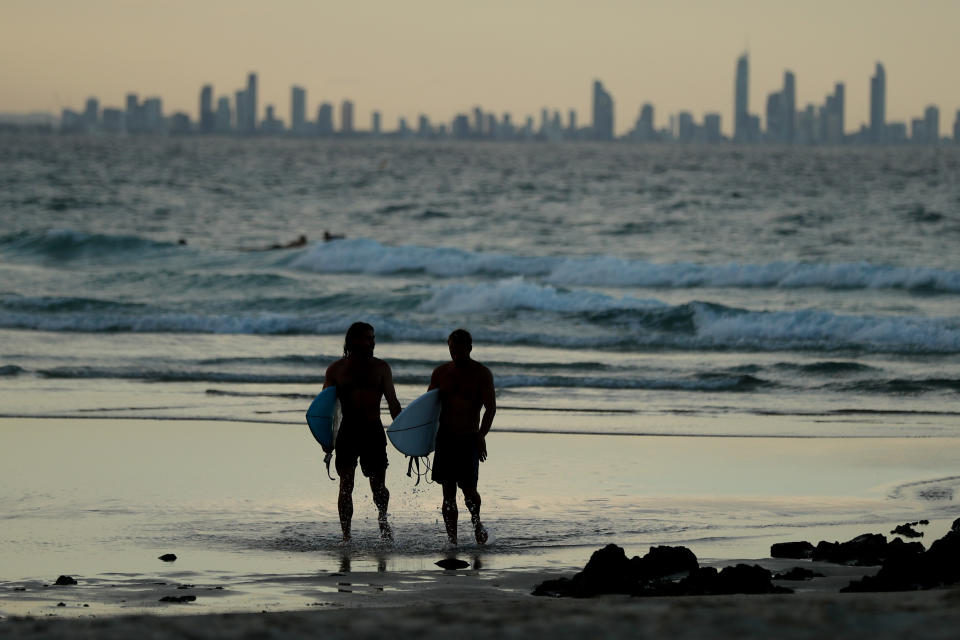 People on the beach at Snapper Rocks which is on the Queensland and New South Wales border at Coolangatta.