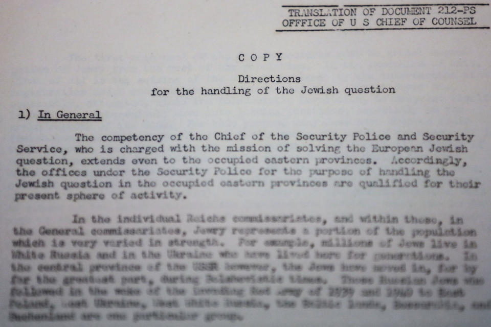 A copy of a translated document from the Nuremberg Trials titled 'Directions for the handling of the Jewish question' is on display in Berlin, Wednesday, Jan. 22, 2014. A collection of documents used by prosecutors at the Nuremberg Trials to help convict top Nazis is being put on public display in Berlin ahead of its auction in Israel. The Berlin Jewish Education Center says the documents going on display Wednesday were discovered by a collector at a flea market in Israel a half year ago and are to be auctioned Jan. 29. Many are English translations of Nazi documents used by prosecutors in their cases against Nazis like Hermann Goering and Rudolf Hess, who were convicted at the international tribunal after the war. (AP Photo/Markus Schreiber)