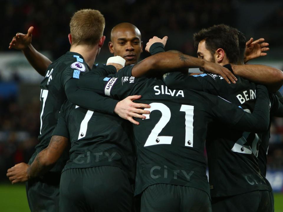 Manchester City sit 11 points clear at the top of the Premier League table`: Getty