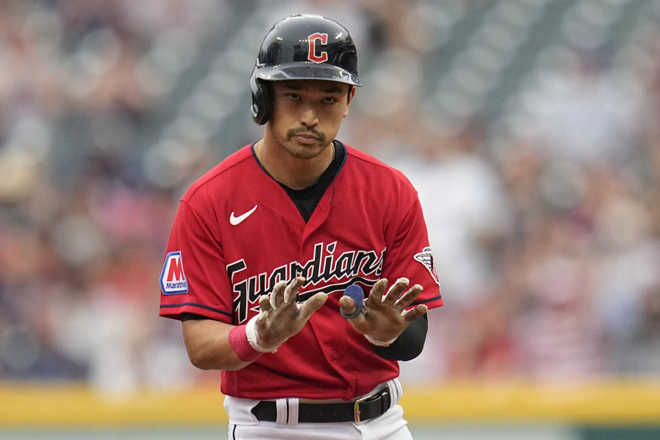 Cleveland Guardians' Steven Kwan gestures at second base after hitting a double against the Toronto Blue Jays during the first inning of a baseball game Wednesday, Aug. 9, 2023, in Cleveland. (AP Photo/Sue Ogrocki)