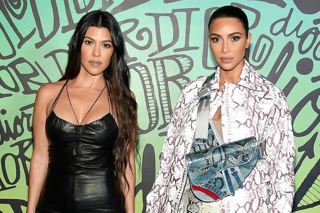 <p>Dimitrios Kambouris/Getty Images</p> Kourtney Kardashian and Kim Kardashian West attend the Dior Men's Fall 2020 Runway Show