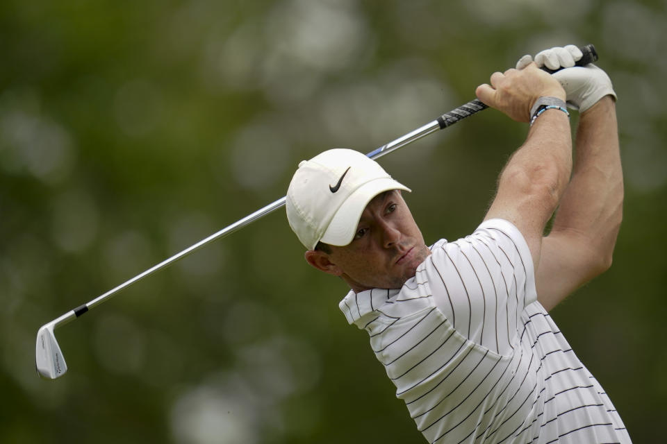Rory McIlroy, of North Ireland, watches his tee shot on the 12th hole during a practice round for the PGA Championship golf tournament, Tuesday, May 17, 2022, in Tulsa, Okla. (AP Photo/Sue Ogrocki)
