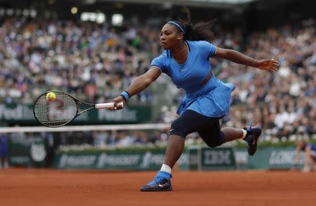 FILE PHOTO - Tennis - French Open Women's Singles Final match - Roland Garros - Serena Williams of the U.S. vs Garbine Muguruza of Spain- Paris, France - 04/06/16 Williams reutrns the ball. REUTERS/Gonzalo Fuentes