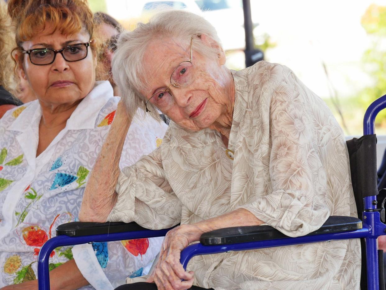 Julia Cousins Laning, foreground, accompanied by her aide, Rosa Northrop, listens as city officials talk about the new Julia Cousins Laning and Dale Laning Archives & Research Center at the October, 2019 ribbon cutting for the facility. Laning, who turned 100 in December, died on July 16.