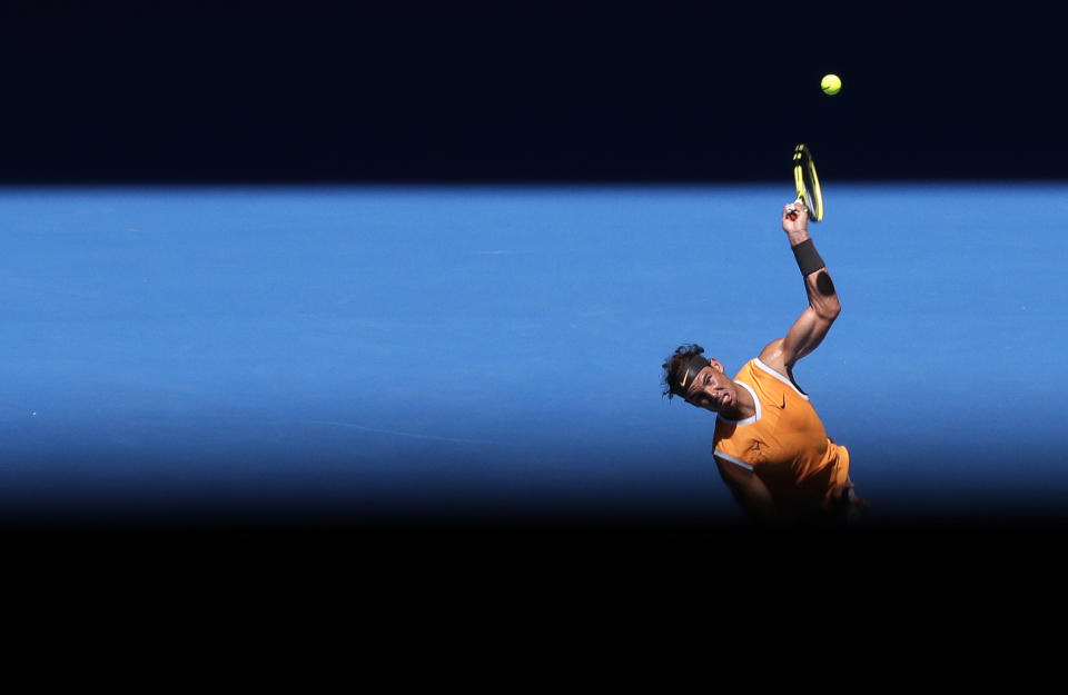 Spain's Rafael Nadal serves to Australia's James Duckworth in their first round match at the Australian Open tennis championships in Melbourne, Australia, Monday, Jan. 14, 2019. (AP Photo/Aaron Favila)