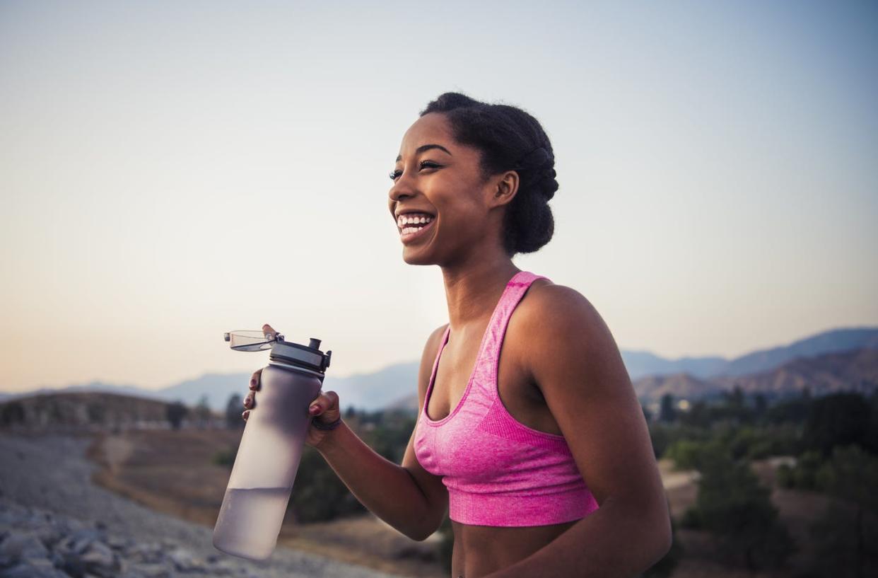 <span class="caption">Exercising can increase your need to drink water, but there's no need to overdo it. </span> <span class="attribution"><a class="link " href="https://www.gettyimages.com/detail/photo/happy-female-runner-holding-water-bottle-royalty-free-image/1012617912?adppopup=true" rel="nofollow noopener" target="_blank" data-ylk="slk:The Great Brigade/Getty Images;elm:context_link;itc:0;sec:content-canvas">The Great Brigade/Getty Images</a></span>