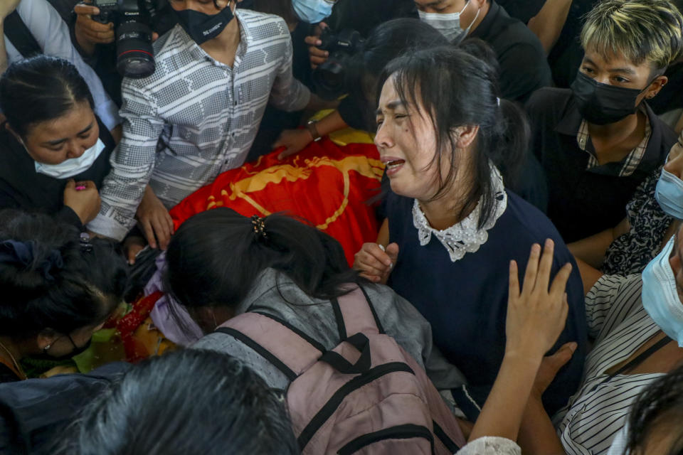 Mother of Khant Ngar Hein weeps during his funeral in Yangon, Myanmar Tuesday, March 16, 2021. Khant Ngar Hein, a 18-year old student of medicine was shot on his chest on Sunday, March 14, in Tamwe, Yangon, by security forces during an anti-crop protest. Demonstrators in several areas of Myanmar protesting last month’s seizure of power by the military held small, peaceful marches before dawn Tuesday, avoiding confrontations with security forces who have shot dead scores of their countrymen in the past few days. (AP Photo)