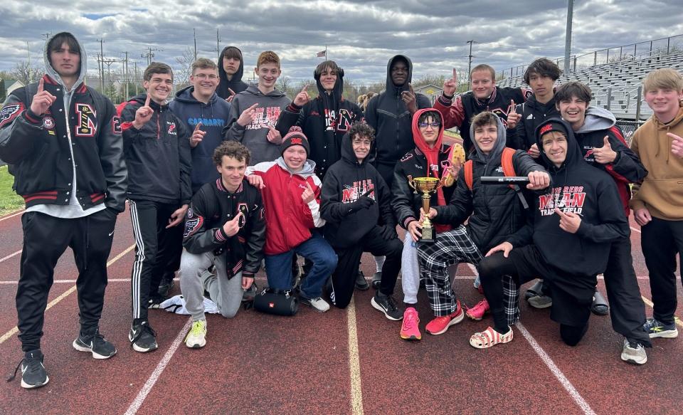 Milan's boys track and field team celebrates after winning the Jefferson Invitational on Saturday, April 20, 2024.
