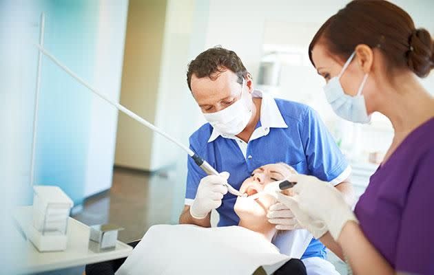 Dentists still advise patients to floss to prevent gum disease. Photo: Getty Images