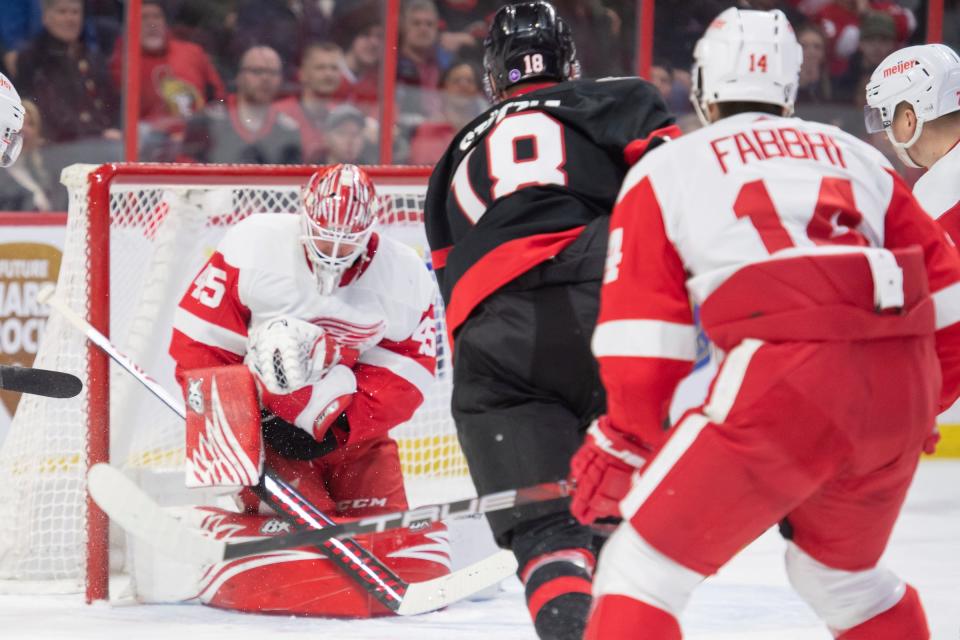 Detroit Red Wings goalie Magnus Hellberg (45) makes a save on a shot from Ottawa Senators left wing Tim Stutzle (18) in the first period at the Canadian Tire Centre in Ottawa, Ontario, on Monday, Feb. 27, 2023.