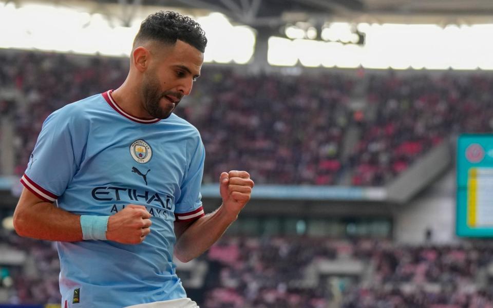 Manchester City's Riyad Mahrez celebrates after scoring his side's second goal - AP Photo/Alastair Grant