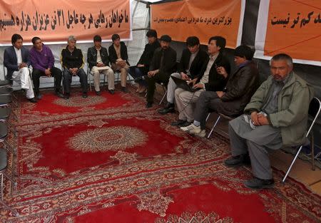 Ethnic Hazara demonstrators gather in a protest tent in Afghanistan's capital demanding action to rescue Hazaras kidnapped from a bus by masked men who many believe are influenced by Islamic State, in Kabul, March 19, 2015. REUTERS/Omar Sobhani