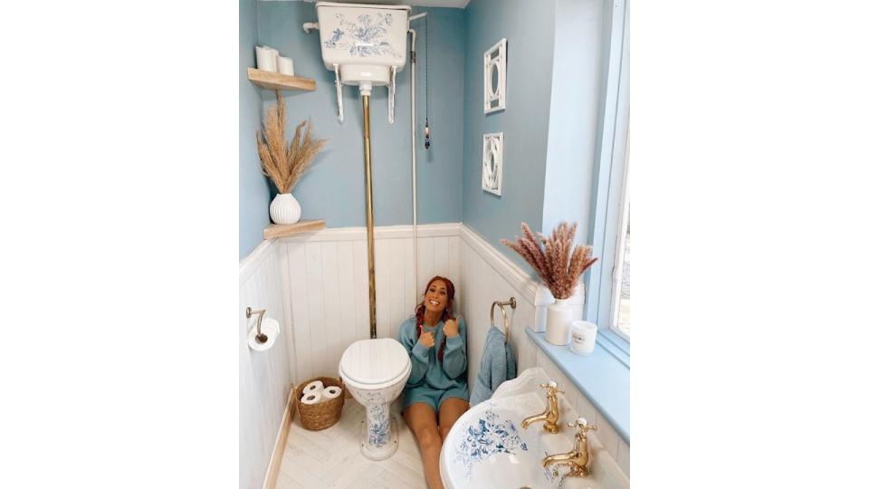 Stacey sitting in her blue loo 