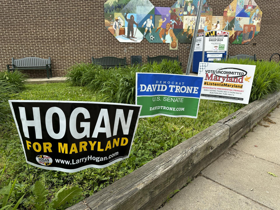 Signs are pictured outside an early voting center on Thursday, May 9, 2024, in Rockville, Md. President Joe Biden and former President Donald Trump look to pad their delegate totals in Maryland Tuesday, May 14. Maryland voters will also decide contested primaries in a Senate race. Former GOP Gov. Larry Hogan's late entry into the race has given Republicans hope of a possible pick-up in a state that hasn't elected a Republican U.S. senator since 1980. The leading Democratic primary candidates are U.S. Rep. David Trone and Prince George's County Executive Angela Alsobrooks. (AP Photo/Robert Yoon)