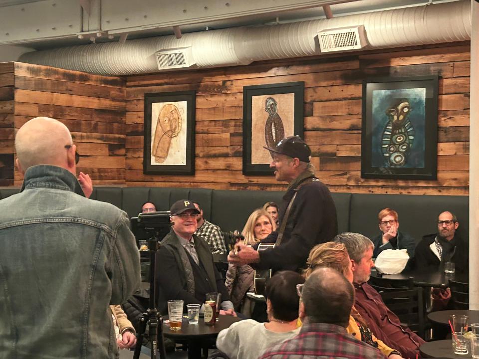 Dan Bern, in the ballcap, serenading a Club Cafe crowd in the encore of his Feb. 7 show.