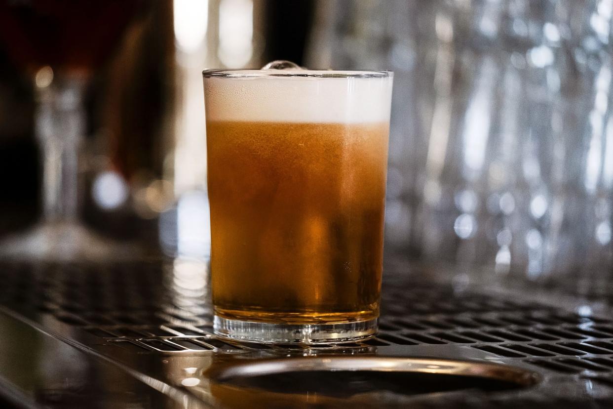 A beer glass on a bar counter