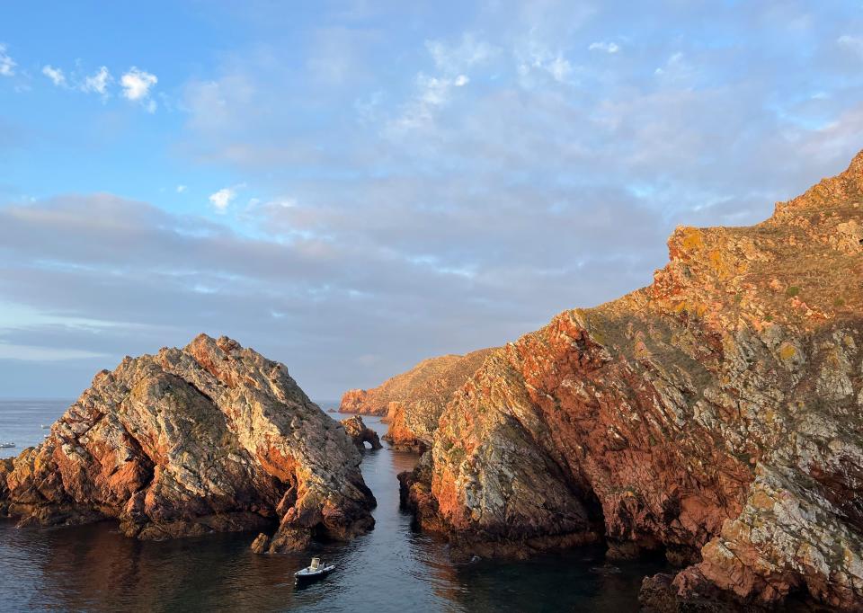 The early morning sun shines on the pink granite rocks on the island of Berlenga in Portugal on Sept. 15, 2023. (Kristen de Groot via AP)