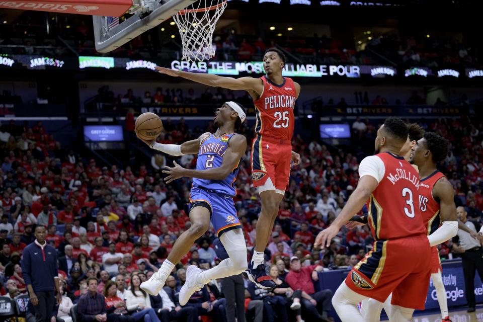 Oklahoma City Thunder guard Shai Gilgeous-Alexander (2) shoots against New Orleans Pelicans guard Trey Murphy III (25) during the second half of an NBA basketball play-in tournament game in New Orleans, Wednesday, April 12, 2023. (AP Photo/Matthew Hinton)