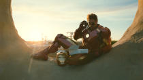 <b>Mark IV:</b> <br> Tony developed a more streamlined suit for the Stark Expo (but it's equally good for picking up doughnuts). In this shot, Robert Downey Jr. is in the full costume, but usually during filming he only wears the top half for the sake of mobility. The mechanical legs are then added in digitally.