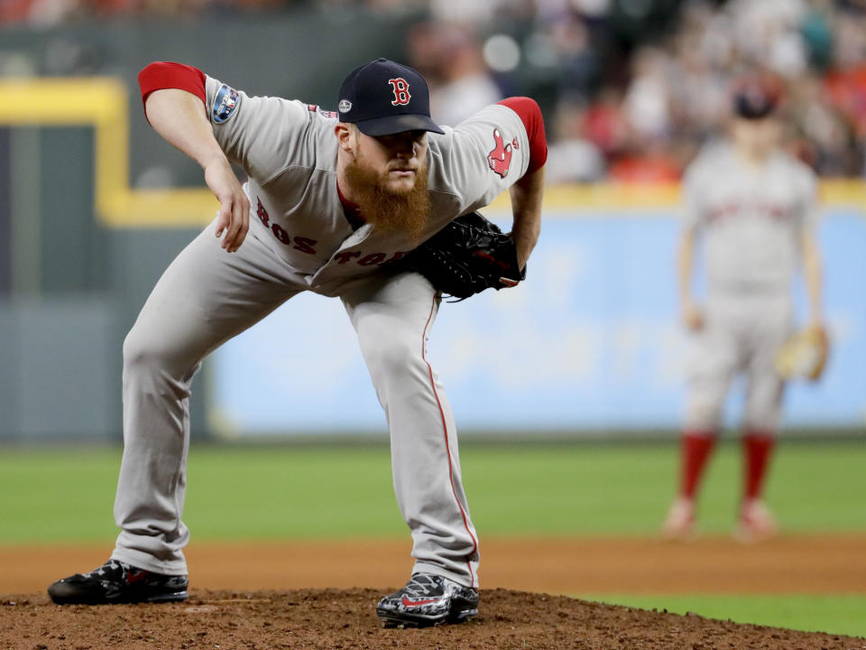 FILE - In this Oct. 17, 2018, file photo, Boston Red Sox relief pitcher Craig Kimbrel prepares to throw against the Houston Astros during the eighth inning in Game 4 of a baseball American League Championship Series, in Houston. Free-agent closer Craig Kimbrel has agreed to a contract with the Chicago Cubs. The team said Friday, June 7, 2019, he has passed his physical. Contract terms were not disclosed.(AP Photo/Frank Franklin II, File)