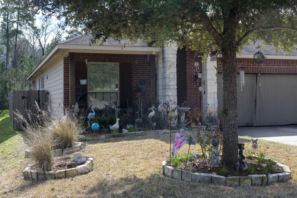 A home in Conroe, Texas, where officers from multiple agencies visited on Monday Feb. 12, 2024, hours after a shooting at Lakewood Church in Houston left a woman dead and a child critically wounded. (Kirk Sides/Houston Chronicle via AP)