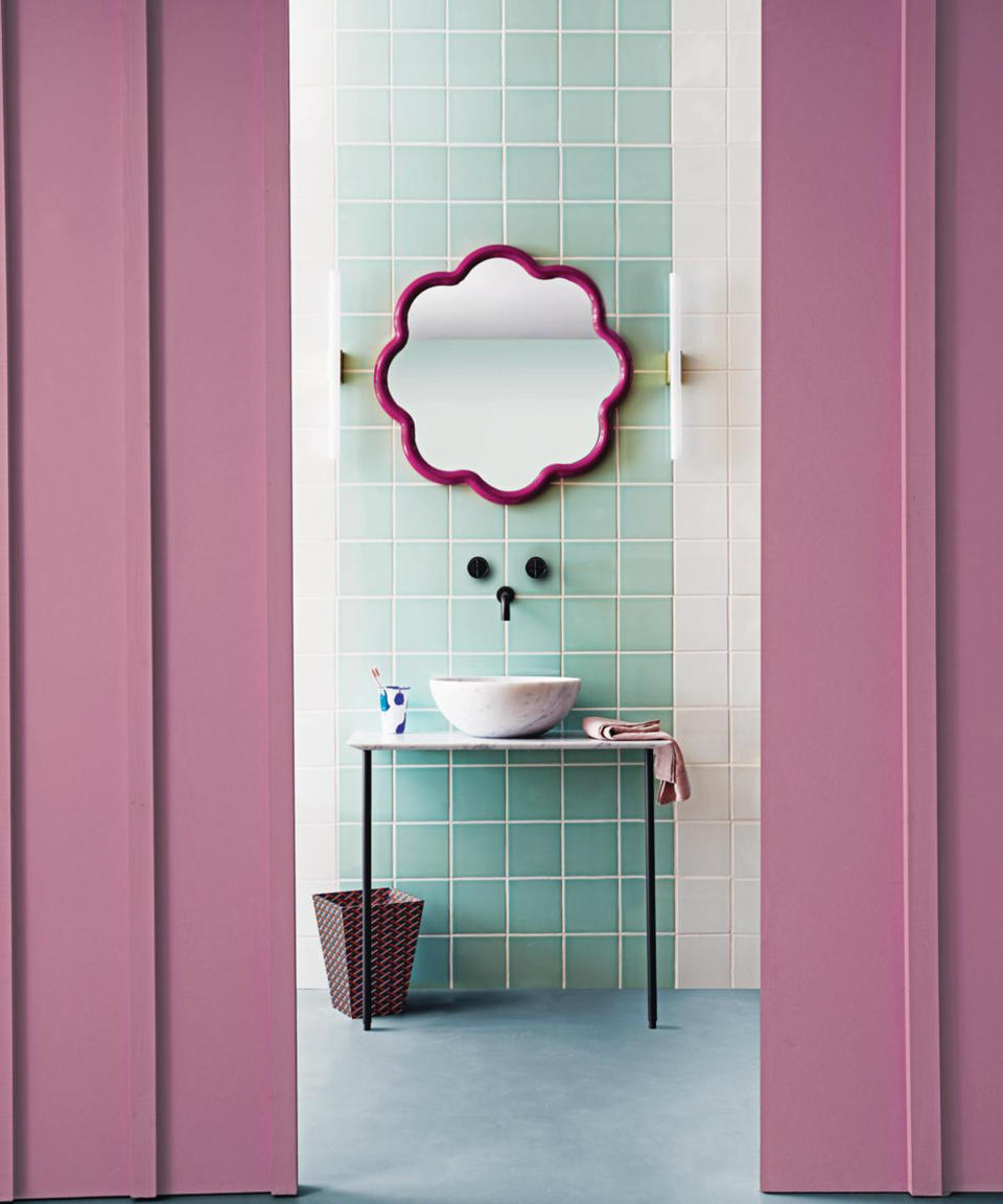 bathroom with pink walls outside and turquoise tiles