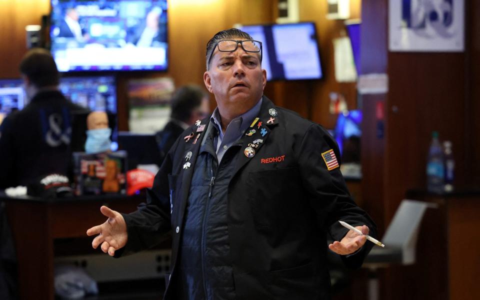 A trader on the floor at the New York Stock Exchange today