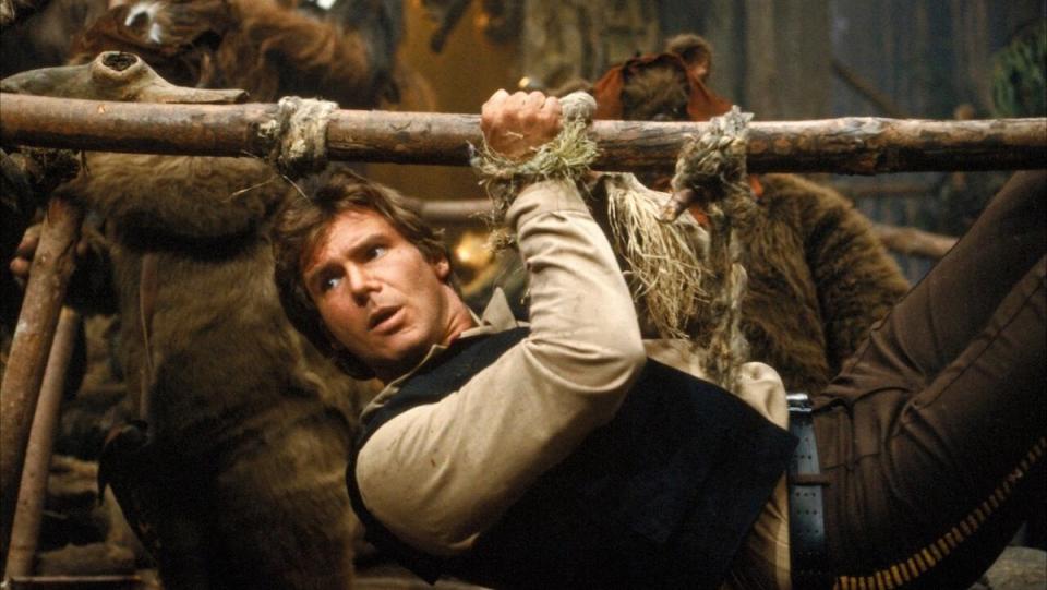 Han Solo hung upside from a pole by Ewoks in Return of the Jedi