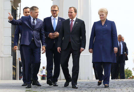 (L-R) Slovakian Prime Minister Robert Fico, Finnish Prime Minister Juha Sipila, Swedish Prime Minister Stefan Lofven and Lithuanian President Dalia Grybauskaite arrive for a family photo during the European Union summit- the first one since Britain voted to quit- in Bratislava, Slovakia, September 16, 2016. REUTERS/Yves Herman
