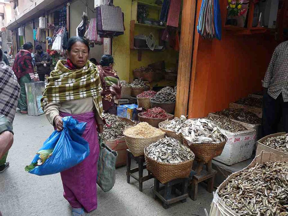 An alley lined with shops selling dried, salted fish.