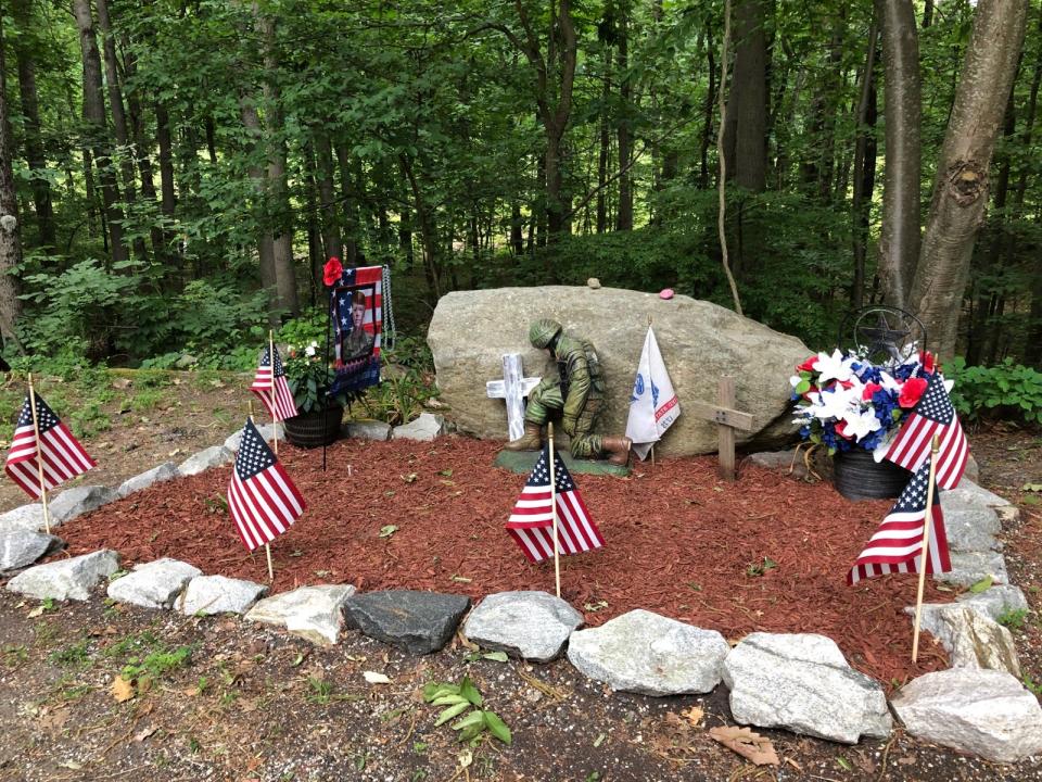 A memorial for Army Cpl. Hayden Harris is seen at the end of Ross Road in Byram, near where his body was found in December 2020, Thursday, June 8, 2023.