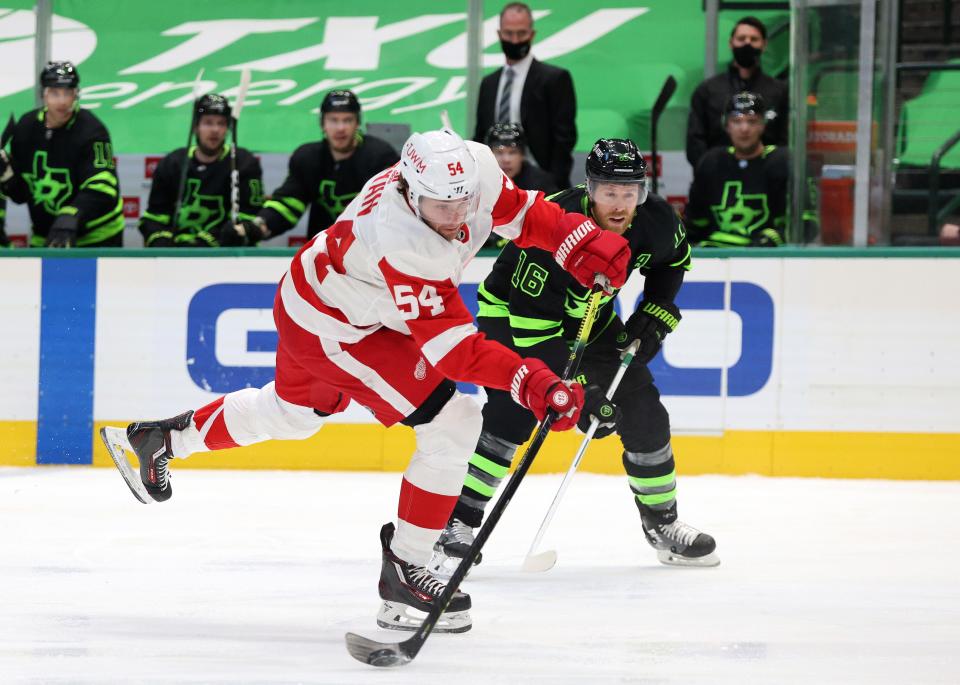 Bobby Ryan (54) of the Detroit Red Wings skates the puck against Joe Pavelski of the Dallas Stars in the first period at American Airlines Center on Jan. 28, 2021, in Dallas, Texas.