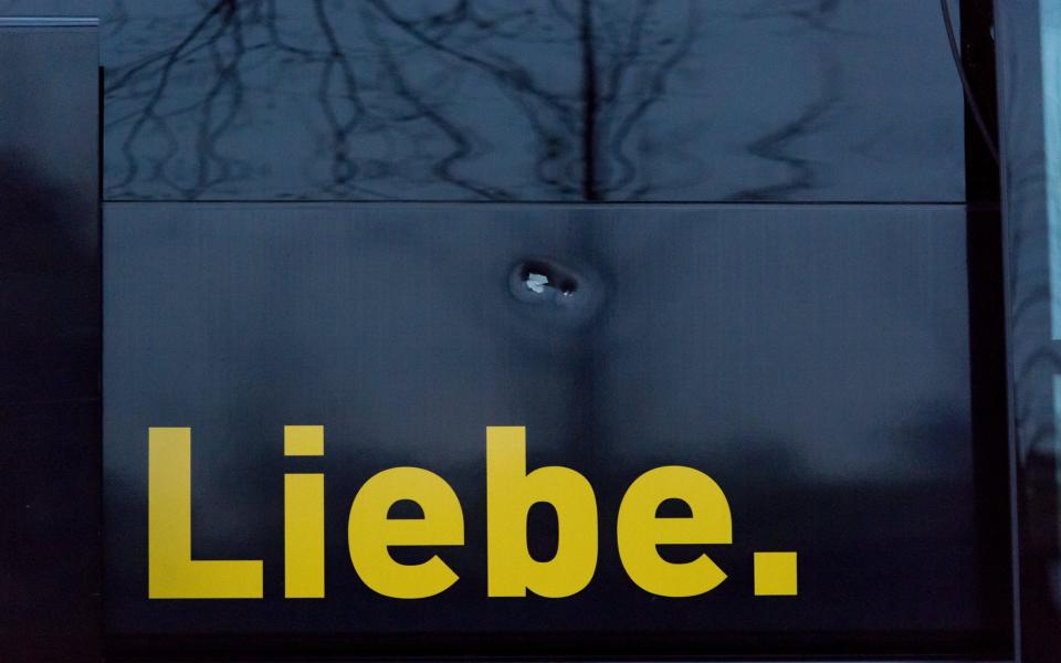 Damage to the Borussia Dortmund team bus - Credit: EPA/STR