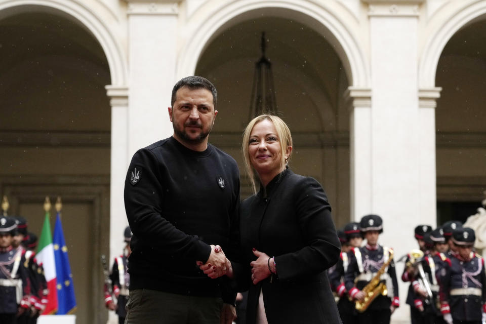 Italian Premier Giorgia Meloni, right, and Ukrainian President Volodymyr Zelenskyy shake hands before their meeting at Chigi Palace, Government's office, in Rome, Saturday, May 13, 2023. Zelenskyy is in Italy for a one-day visit and will meet with Pope Francis at The Vatican. (AP Photo/Alessandra Tarantino)