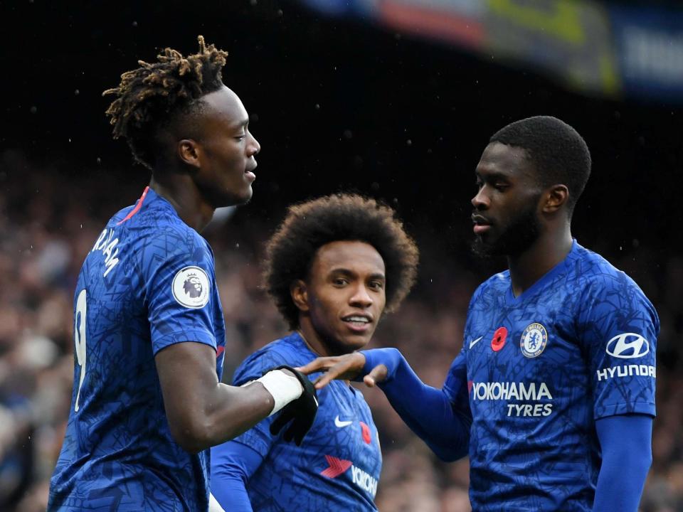 Tammy Abraham of Chelsea celebrates with teammate Fikayo Tomori: Getty Images