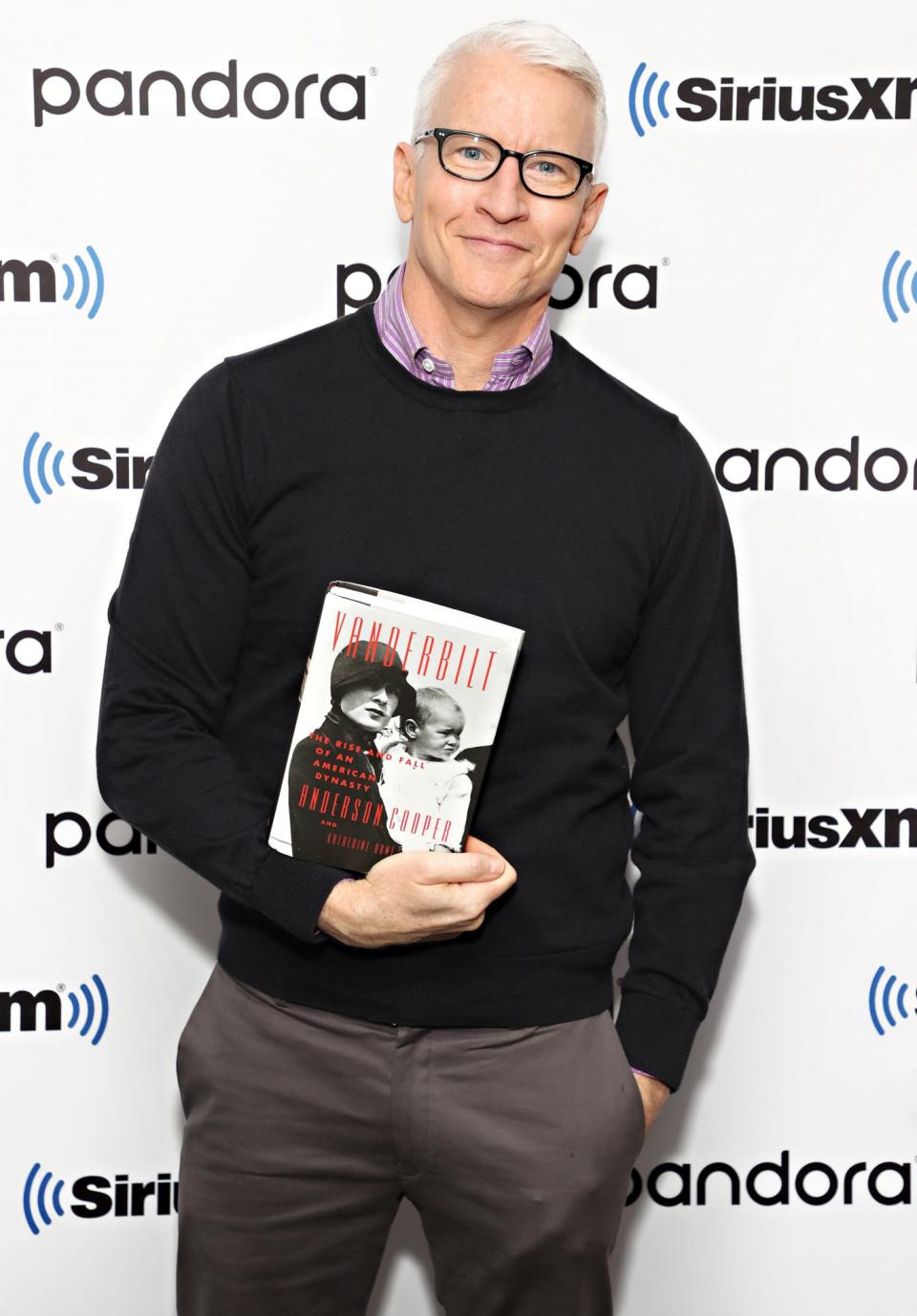 <p>Anderson Cooper holds his new tome on Sept. 22 ahead of an interview on SiriusXM in New York City.</p>