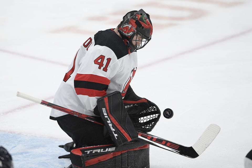 New Jersey Devils goaltender Scott Wedgewood stops the puck during the first period of the team's NHL hockey game against the Washington Capitals, Tuesday, March 9, 2021, in Washington. (AP Photo/Nick Wass)
