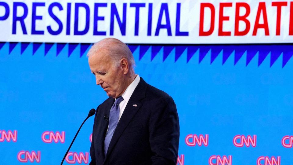 PHOTO: Democratic presidential candidate U.S. President Joe Biden listens, as Republican presidential candidate and Donald Trump speaks, during their debate in Atlanta, Georgia, June 27, 2024. (Brian Snyder/Reuters)