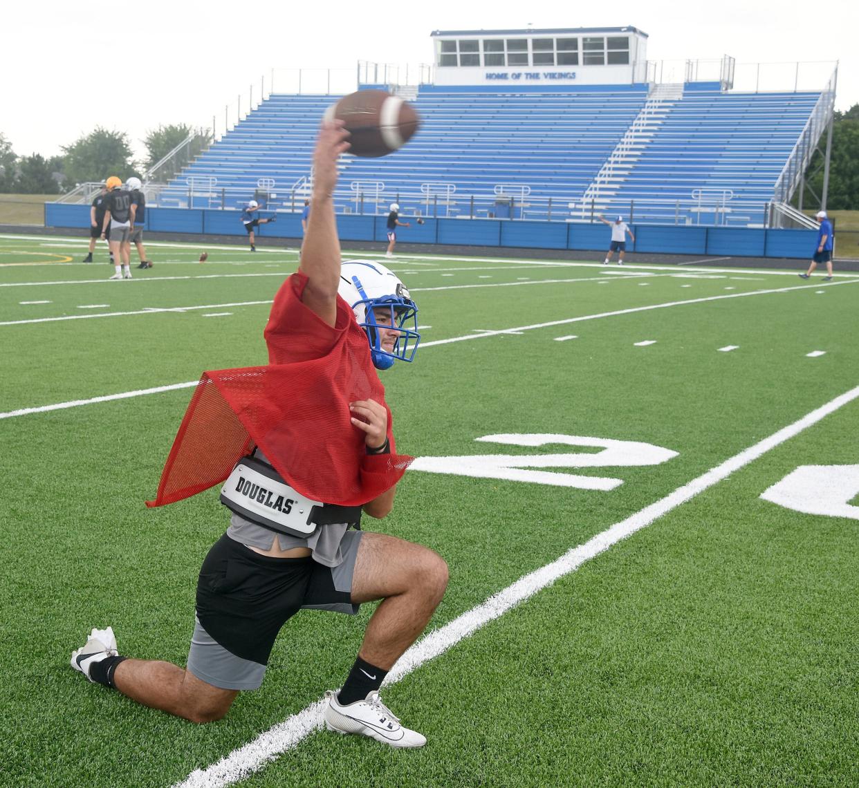 Dundee Vikings quarterback Ryan Zanger warms up at a recent practice on the new turf field inside the new John D. Craig and Family Athletic Complex.