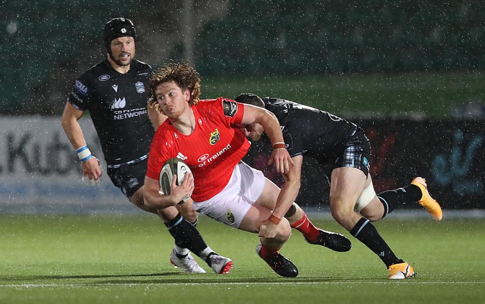 Ben Healy of Munster is tackled by Robbie Fergusson of Glasgow Warriors - GETTY IMAGES 