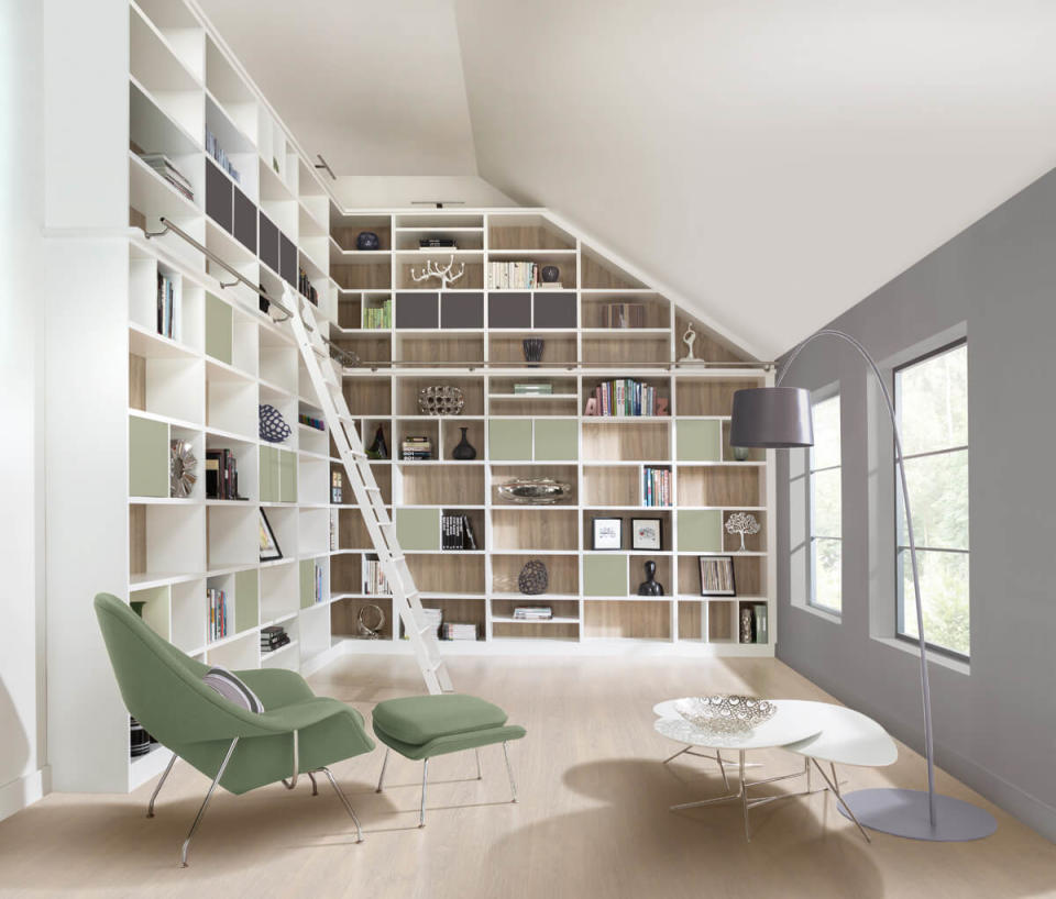 <p>A dream sanctuary for book lovers, a library provides the ideal space for homeowners to unwind in and enjoy reading their favourite novel. </p><p>Installing bookshelves is the perfect way to avoid libraries becoming messy and cluttered. Installing bespoke shelving which can be adjusted to suit the size of your library, even the most awkward of ceilings.<br></p><p>This <a href="https://www.nevillejohnson.co.uk/modern-library/" rel="nofollow noopener" target="_blank" data-ylk="slk:modern library space by Neville Johnson;elm:context_link;itc:0;sec:content-canvas" class="link ">modern library space by Neville Johnson</a> provides ample shelving for all storage needs, and consequently makes the home feel minimalistic and tidy. The white shelves combined with sage green and the rustic oak finish, this uplifting and harmonious scheme.<br></p>