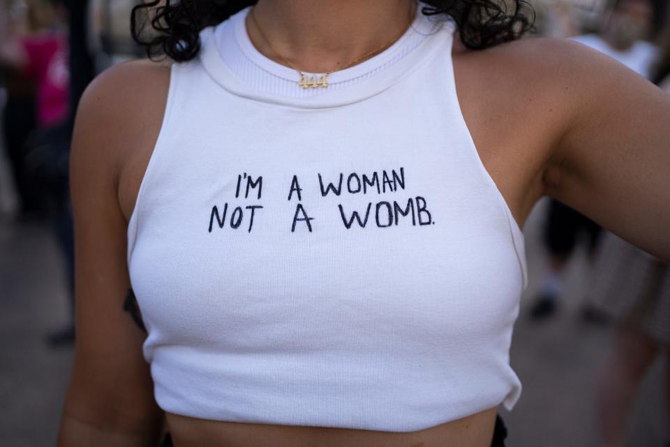 Alexis Voss, Obetz, wears her sign on her shirt, during an abortion rights protest Friday, June 24, 2022, at the Ohio State House, after the Supreme Court decision to overturn Roe v Wade.