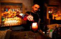 A barman prepares a spritz cocktail with Aperol at the "Spirit de Milan" in Milan, Italy, May 19, 2018. REUTERS/Stefano Rellandini