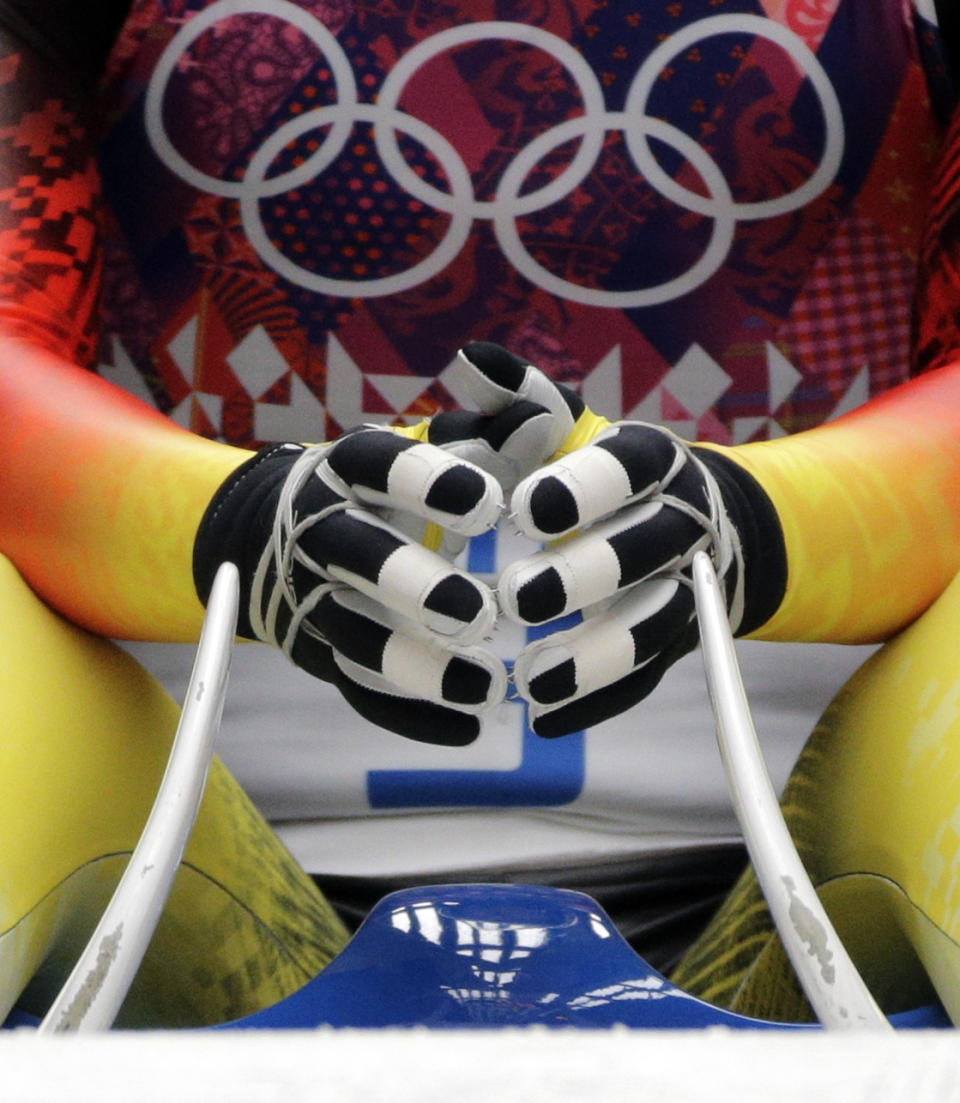 Tatjana Huefner of Germany prepares to start her first run during the women's singles luge competition at the 2014 Winter Olympics, Monday, Feb. 10, 2014, in Krasnaya Polyana, Russia. (AP Photo/Jae C. Hong)