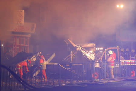 Members of the emergency services work at the site of an explosion which destroyed a convenience store and a home in Leicester, Britain, February 25, 2018. REUTERS/Darren Staples